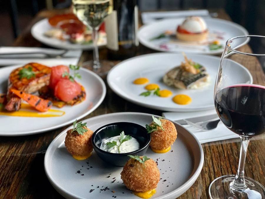 Croquettes with herb dip, plated alongside other Park's Edge dishes